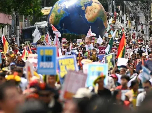 Indigenous-Led ‘Great People’s March’ Draws 50,000 Protesters Outside COP30 in Belém